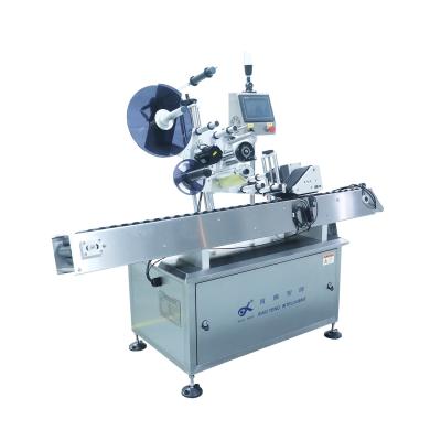 China CLOTHING automatic horizontal round bottle labeling machine small round tube labeling machine for sale