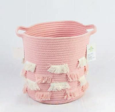 China Sustainable Pink Cotton Rope Storage Basket Body With Tassels Laundry Basket for sale