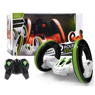 China Cool Igniting RC Hobby Rc Stunt Car Kids Boy Surprise Gift Two Big Wheels Turning Flip Radio Control Stunt Car For Wholesale for sale