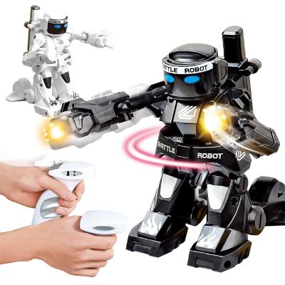 China 2.4G Rc Toy Battle Battery Operated Somatosensory Robot Toys 2 Person Competition Robot Light Fight Sound Remote Control Robot For Kids for sale