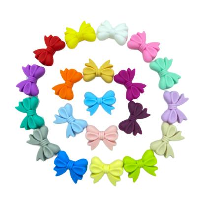 China High Quality Soft Toy Hot Sale Food Grade BPA Free Colorful Bowknot Beads Flower Forming Silicone Chewable Beads For Jewelry Making for sale