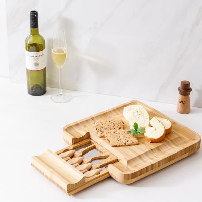 China 2021 Sustainable Hot Bamboo Cheese Board Household Square Cheese Board With Knife And Drawer Cutting Board for sale