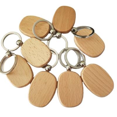 China Custom Wooden Logo Engraving Wooden Cute Mute Key Chain Key Ring for sale