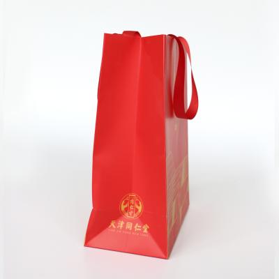 China Recyclable Paper Shopping Bag , Custom LOGO Printed Low Cost Paper Bag for sale