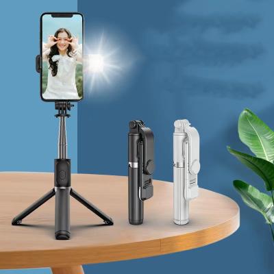 China Fold Up Popular 2021 Newest 1M Long Handheld Telescopic Selfie Wireless Remote Stick With Sufficiency Light And Tripod Stand Selfie Stick for sale