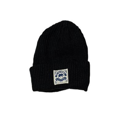 China JOINT Custom Knit Hat Beanie With Woven Label Patch for sale