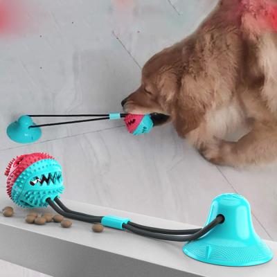 China Stored Interactive Rubber Chew Dog Suction Cup Treat Ball Dog Pet Toys With Suction Cup Rope for sale