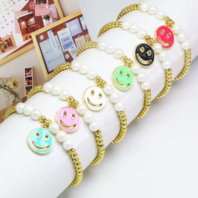 China 2021Factory BOHEMIA prices small face bead charm enamel bead children smile wrist enamel chain copper bracelet women for sale