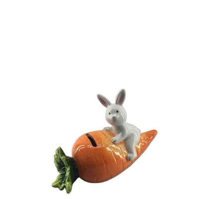 China Simple Modern Ceramic Carrot Rabbit Shape Stonerware Coin Bank Money Bank For Kids Gifts for sale