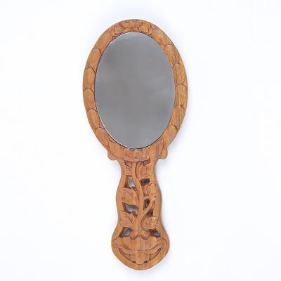 China Custom Portable Natural Wood Engraving Patterns Handmade Portable Handle Round Cosmetic Mirror for sale