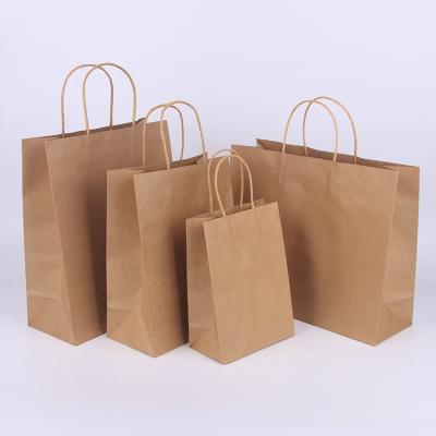 China Medium Size Kraft Brown Paper Gift Bags Bulk With Handles for sale