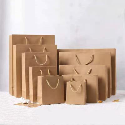 China Gift & Wholesale Custom Printed Craft Shopping Brown Gift Handles Kraft Paper Bag With Your Own Logo for sale