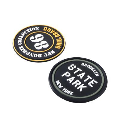 China Viable Cheaper Custom Military 3D Gun Logo Hook Backing PVC Silicone Patches For Apparel PVC Patch Velcro for sale