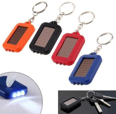 China Custom Mini Custom Logo Rechargeable Solar Powered Outdoor Camping LED Light Solar Convenient Gift Flashlight Key Chain for sale