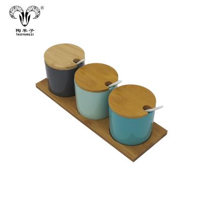 China Food Safe Green Kitchenware 3pcs Ceramic Spice Jar Set With Bamboo Tray for sale