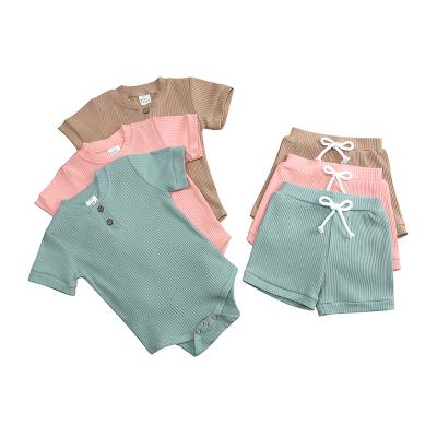 China Breathable Ribbed 100% Cotton Knitted Newborn Baby Clothes Summer Short 2 Piece Set Toddler Boys Girls Sleepwear Pajamas Set for sale