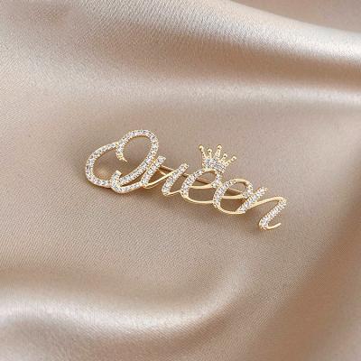 China Popular Fashion Gold Plated Custom Alloy Word Brooches Women Saree Crown Queen Brooch for sale