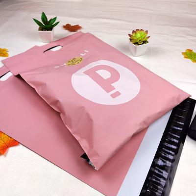 China Strong Adhesive Biodegradeable Custom Matte Pink Mailer Bag Postage Packaging Tamper Proof Messenger Bags With Handle for sale