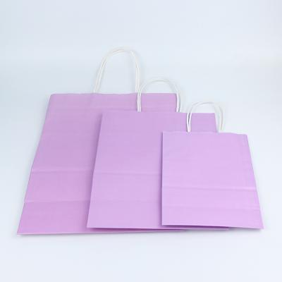 China Custom Design Pink Materials Logo Recycled Kraft Paper Luxury Shopping Packaging Bag For Handle for sale