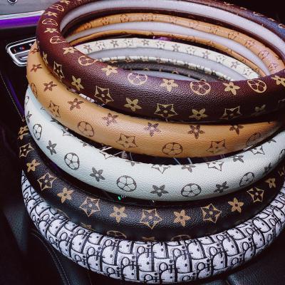 China Perfectly Fit 2022 Four Seasons Universal Car Top Size 15 Inch/38 cm Luxury Odorless Fashion Steering Wheel Covers Breathable for sale