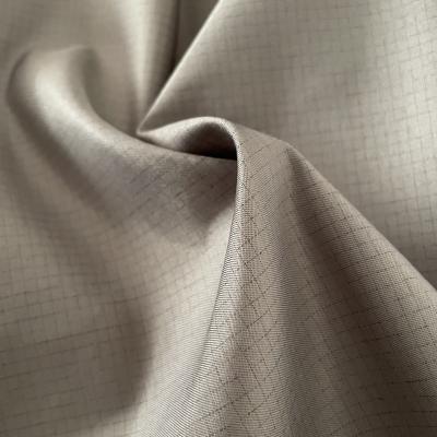 China 100% fire retardant polyester twill ripstop 0.2*0.2 peach skin fabric used for workwear garments for sale