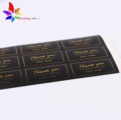 China Waterproof Sticker Custom Gold Hot Foil Stamping Self Adhesive Sticker Label for sale