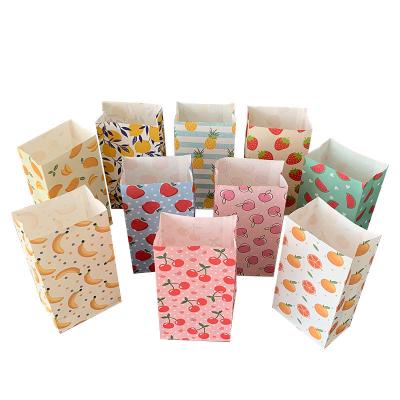 China Small Eco-friendly Dot Color 50pcs Fruit Wave Paper Bag 23x12x7.5cm Gift Paper Cosmetic Treat Paper Bags for sale