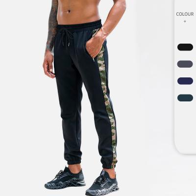 China Autumn Loose Casual Sports Trousers Men's Breathable Zipper Pocket Fitness Sweatsuit Gym Jogger Pants And Trousers for sale