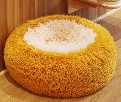 China Donut Anti Anxiety Round Fluffy Dog Bed With Anti Slip Waterproof Bottom for sale