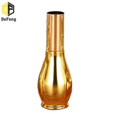 China Essential Oil Bottle Plating Essential Oil Glass Bottle Spray Glass Bottle Perfume Gold Bottle for sale