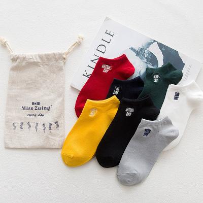 China Solid Color Sporty Warm Unisex Cotton Week Letter Invisible Short Women's Socks For Women And Men Stockings for sale