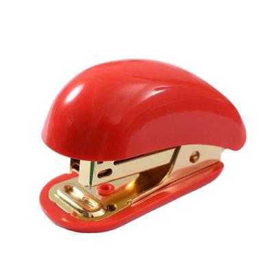 China Set Gift Christmas Day Christmas Red-Green-Gold No12 Stapler Mini Stapler Cultural And Creative Office Supplies for sale