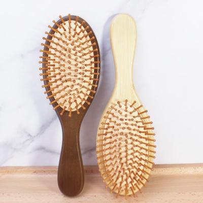 China Hot Selling Natural Wooden Paddle Bristle Comb Massage Head Care Wooden Paddle Hair Brush for sale