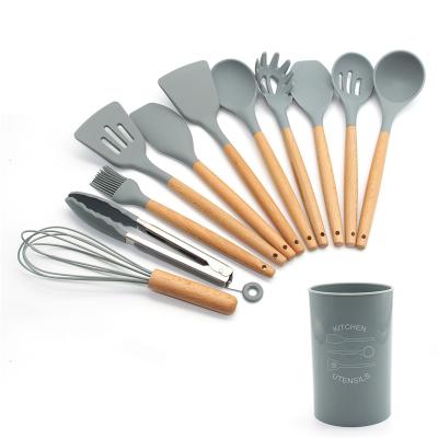 China Sustainable Amazon hot sale silicone cookware 12pcs silicone kitchen utensils sets with wooden handle for sale