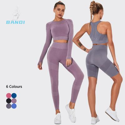 China Breathable 2023 New Manufacturer Seamless 4 Piece Yoga Set Gym Fitness Clothing Women Mesh Hollow Out Long Sleeve Crop Top Yoga Set for sale