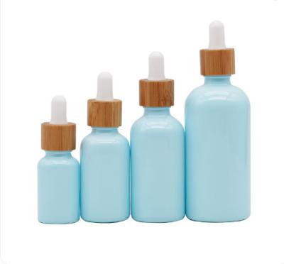 China Amber Clear Blue Bulk Bottle 30ml 50Ml 10Ml Safe Custom Logo Child Dropper Essential Oil Glass Bottle Factory Price In Stock for sale