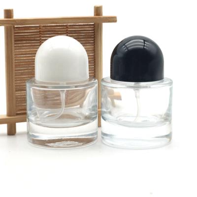 China Personal Care 30ml Perfume Round Empty Glass Perfume Bottle Black Cap Cylinder Bottle Perfume for sale