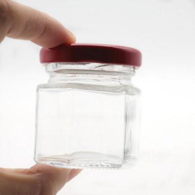 China Wholesale 60g 500g 1000g Stocked Hexagon Honey Glass Jar With Metal Closing Lid Honey Jars Glass Hexagon for sale