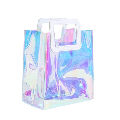 China Waterproof Reusable Plastic Clear Wedding Bags Laser PVC Gift Bags With PU Handle For Packaging for sale