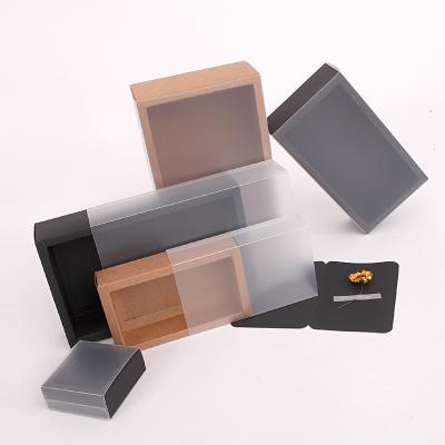 China Custom Recyclable Brown Frosted PVC Sleeve Slip Box Kraft Paper Candy Chocolate Packaging Drawer Boxes With Clear Window for sale