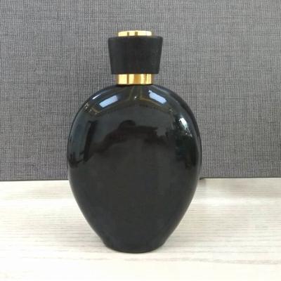 China Personal Care 90ml Black Flat Round Oval Glass Perfume Bottle for sale