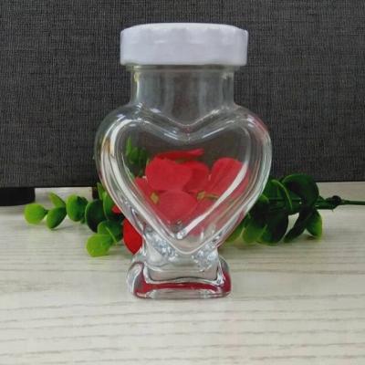 China Beverage Wholesale 100ml Heart Shape Candy Glass Jar Wishing Bottle for sale