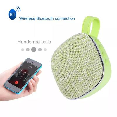 China Wireless DC 5V 300mah built in battery ABS sprayed with rubber oil X25 mini portable fabric speaker for sale