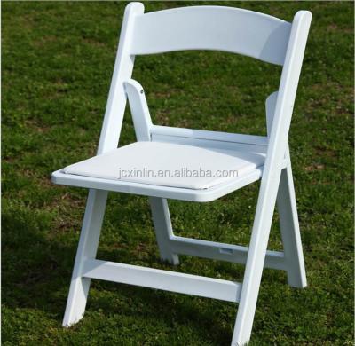 China Solid Wood White Commercial Wooden Folding Chair With Vinyl Padded Seat for sale