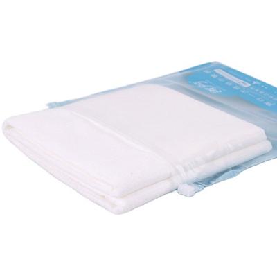 China Disposable Beauty Salon Towels Travel Cotton Fabrics Towel Luxury Soft Nonwoven Disposable Bath Towel for sale