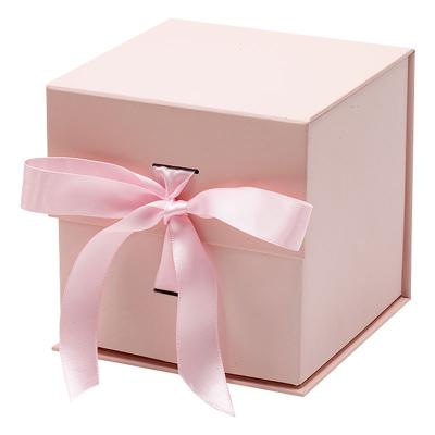 China Recycled Materials Paper Small Cube Pink Cardboard Stock Paper Flip Folding Top Gift Boxes With Ribbon for sale