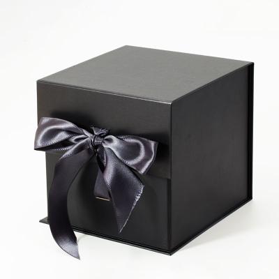 China Durable Custom Black Foldable Cardboard Paper Cube Storage Boxes With Ribbon for sale