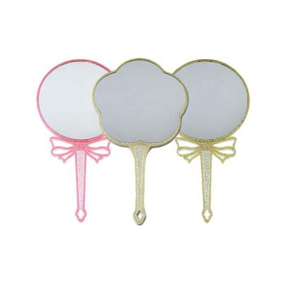 China New Magnifying Design Min Order Double Side Style And Magnifying Type Custom Glitter Makeup Beaty Plastic Hand Mirror for sale