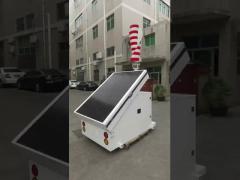 Portable solar trailer with wind turbine