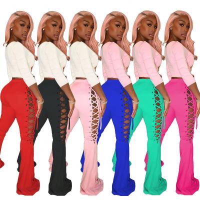 China 2021Women Fashion Anti-wrinkle Clothing Bandage Hollow Bell Bottom Pants High Hip Lift Pants Nightclub Waist Tight Pants for sale